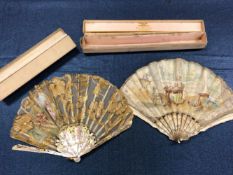 TWO BOXED FANS, THE MOTHER OF PEARL STICKS CARVED AS FEATHERS, ONE LEAF PAINTED WITH A LADY