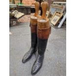 A PAIR OF MID 20th C. MENS BROWN TOPPED BLACK RIDING BOOTS WITH TREES, THE WIDTH OF THE SOLES.