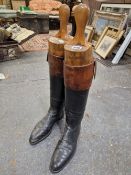 A PAIR OF MID 20th C. MENS BROWN TOPPED BLACK RIDING BOOTS WITH TREES, THE WIDTH OF THE SOLES.