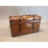 AN OSILITE SUITCASE BY H J CAVE & SONS, THE LEATHER CORNERED LID. 75 x 46cms.