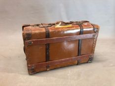 AN OSILITE SUITCASE BY H J CAVE & SONS, THE LEATHER CORNERED LID. 75 x 46cms.