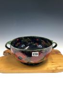 A WILLIAM MOORCROFT POMEGRANATE PATTERN TWO HANDLED BOWL. Dia. 25cms.