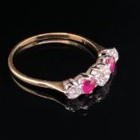 A VINTAGE RUBY AND DIAMOND FIVE STONE GRADUATED HALF HOOP RING. CENTRE DIAMOND MEASUREMENTS 4.8 X