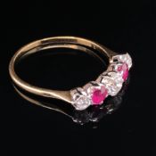 A VINTAGE RUBY AND DIAMOND FIVE STONE GRADUATED HALF HOOP RING. CENTRE DIAMOND MEASUREMENTS 4.8 X