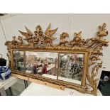 A 19th C. TRIPLE BEVELLED GLASS PLATE MIRROR IN FRAME, PIERCED AND CARVED WITH FLOWERS, SCROLL AND