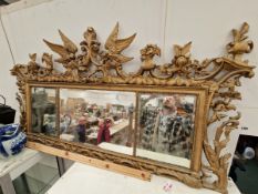 A 19th C. TRIPLE BEVELLED GLASS PLATE MIRROR IN FRAME, PIERCED AND CARVED WITH FLOWERS, SCROLL AND