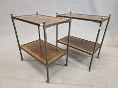 A PAIR OF LEATHER INSET TWO TIER BRASS TABLES. W 52 x D 31.5 x H 59cms.