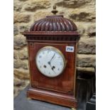 A 19th C. MAHOGANY MANTLE CLOCK, THE FRENCH MOVEMENT STRIKING ON A COILED ROD, THE CIRCULAR ENAMEL