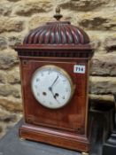 A 19th C. MAHOGANY MANTLE CLOCK, THE FRENCH MOVEMENT STRIKING ON A COILED ROD, THE CIRCULAR ENAMEL
