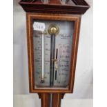 A RUSSELL OF NORFOLK MAHOGANY STICK BAROMETER WITH AN ALCOHOL TO ONE SIDE OF THE SILVERED DIAL THE