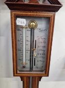 A RUSSELL OF NORFOLK MAHOGANY STICK BAROMETER WITH AN ALCOHOL TO ONE SIDE OF THE SILVERED DIAL THE