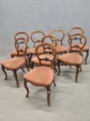 A SET OF EIGHT 19th C. MAHOGANY BALLOON BACK CHAIRS, THE HORIZONTAL BACK RAILS CENTRED WITH A
