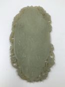 A CHINESE NEPHRITE JADE PLAQUE CARVED IN RELIEF WITH AN ELEPHANT ON ONE SIDE AND WITH A DRAGON ON