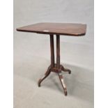 A 19th C. MAHOGANY TABLE, THE ROUNDED RECTANGULAR TOP ON FOUR CYLINDRICAL COLUMNS FLARING TO RING