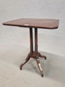 A 19th C. MAHOGANY TABLE, THE ROUNDED RECTANGULAR TOP ON FOUR CYLINDRICAL COLUMNS FLARING TO RING