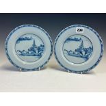 A PAIR OF 18th C. ENGLISH DELFT BLUE AND WHITE PLATES PAINTED WITH CHINOISERIE ISLAND SCENES. Dia.