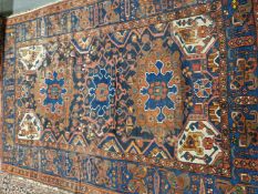 AN ANTIQUE PERSIAN TRIBAL CARPET 308 x 219cms