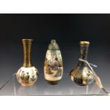 FOUR JAPANESE SATSUMA MINIATURE VASES, TWO OF BOTTLE SHAPE AND THE THIRD OVOID, EACH PAINTED WITH