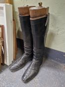 A PAIR OF EARLY 20th C. MEN'S BLACK RIDING BOOTS WITH TREES, THE WIDTH OF THE SOLE. 30cms