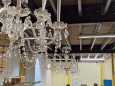 A SET OF THREE CHANDELIERS, EACH WITH TWELVE BRANCHES HUNG WITH DROPS AND IN TWO TIERS ABOUT THREE