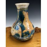 A LISE B MOORCROFT 1992 FISH PATTERN BOTTLE VASE, THE GOLD FISH ON A BLUE GROUND. H 25.5cms.