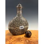AN INDIAN WHITE METAL OVERLAY FLASK AND STOPPER PIERCED AND ENGRAVED WITH BIRDS AND FOLIAGE.. H