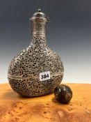 AN INDIAN WHITE METAL OVERLAY FLASK AND STOPPER PIERCED AND ENGRAVED WITH BIRDS AND FOLIAGE.. H
