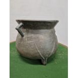 A BRONZE TRIPOD CAULDRON, THE TRIANGULAR HANDLES ATTACHED TO THE FLARED RIM AND ROUNDED SHOULDERS. H