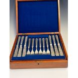 A VICTORIAN MAHOGANY CASED SET OF TWELVE BEAD PATTERN ELECTROPLATE FISH KNIVES AND FORKS, THE BLADES