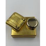 A VINTAGE ESTEE LAUDER GOLDEN PILLOW COMPACT AS NEW IN BOX, TOGETHER WITH AN UNUSED FURTHER ESTEE