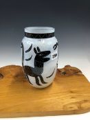 A COSTA BODA VASE DESIGNED AND PAINTED BY ULRICA HYDAMN VALLIEN (1938-2018) WITH SNAKES, A FACE