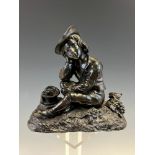 A 19th C. BRONZE FIGURE OF A SEATED BOY SOMNULENT AFTER A PICNIC. W 15cms.