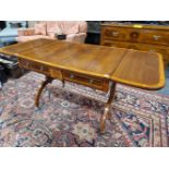 A REGENCY SATIN WOOD CROSS BANDED RED WOOD SOFA TABLE, THE ROUNDED RECTANGULAR FLAP TO WITH A