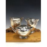 A SILVER TEA POT AND HOT WATER JUG BY BARNARDS, LONDON 1940, TOGETHER WITH A COFFEE POT BY VINERS,