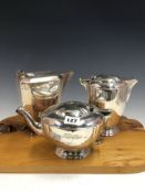 A SILVER TEA POT AND HOT WATER JUG BY BARNARDS, LONDON 1940, TOGETHER WITH A COFFEE POT BY VINERS,