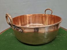 A 19th C. COPPER TWO HANDLED JAM PAN. Dia. 47.5cms.