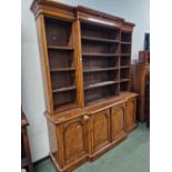 A VICTORIAN POLLARD OAK BREAKFRONT BOOKCASE, THE UPPER HALF WITH ADJUSTABLE SHELVING, THE BASE