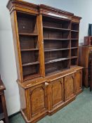 A VICTORIAN POLLARD OAK BREAKFRONT BOOKCASE, THE UPPER HALF WITH ADJUSTABLE SHELVING, THE BASE