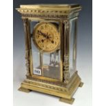 A MARTI MANTEL CLOCK IN A BEVEL GLAZED BRASS CASE, THE DIAL WITH ARABIC NUMERALS, THE MOVEMENT
