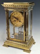 A MARTI MANTEL CLOCK IN A BEVEL GLAZED BRASS CASE, THE DIAL WITH ARABIC NUMERALS, THE MOVEMENT