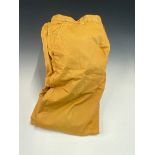 A PAIR OF HERMES COTTON LYCRA MIX OCHRE TROUSERS WAIST SIZE 33/34