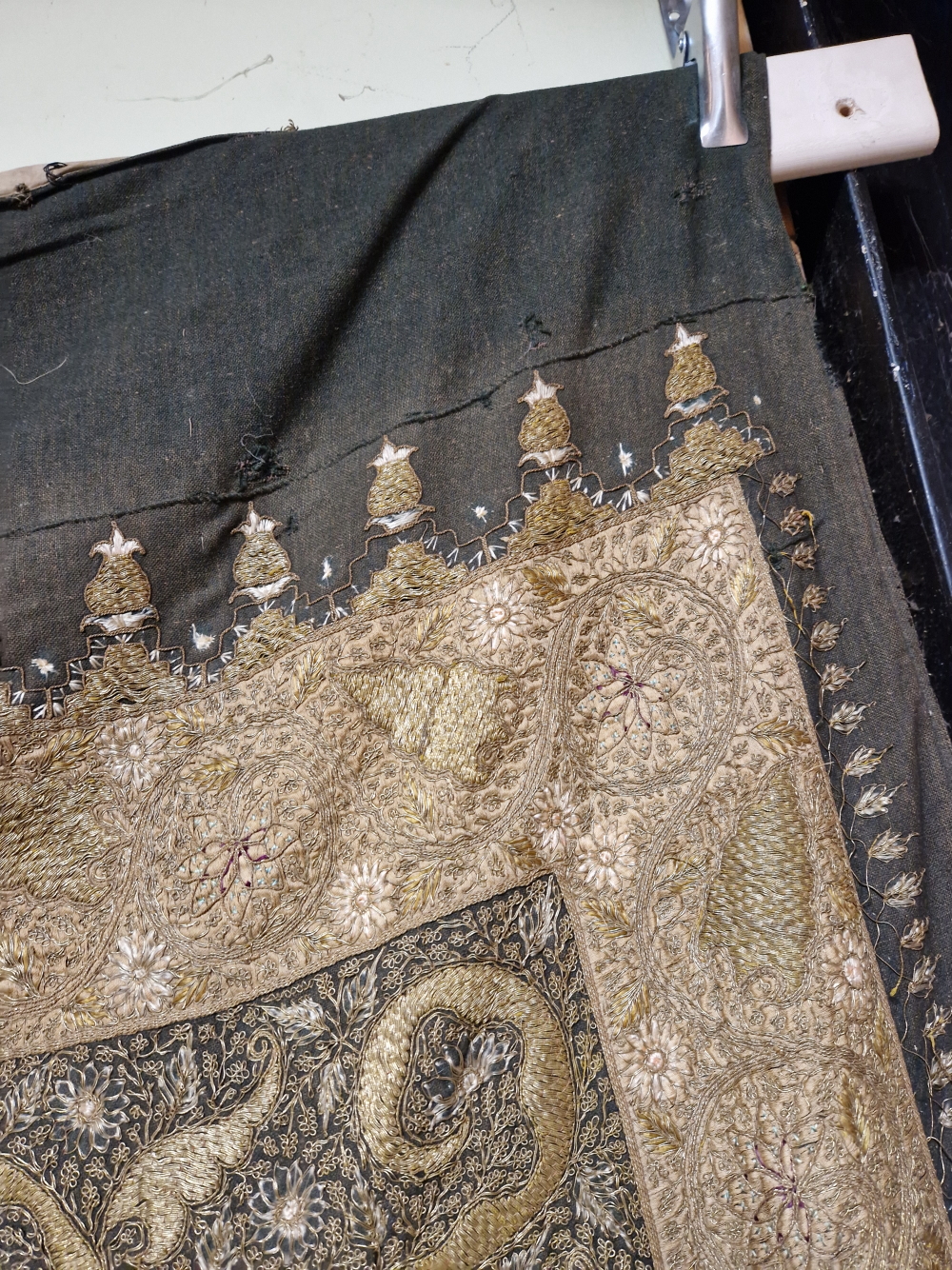 AN INDIAN PANEL SEWN IN GOLD THREAD AND COLOURED SILKS WITH A CANDELABRUM ABOVE A LEAF WITHIN AN - Image 4 of 5