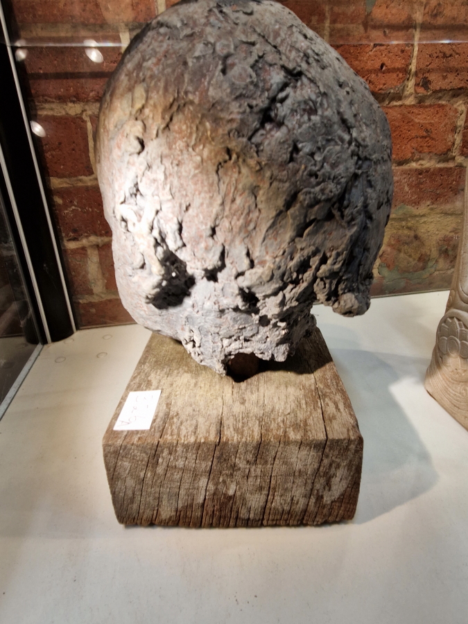 A SCULPTED HEAD OF A CHILD MOUNTED ON A SQUARE WOODEN PLINTH.   H 31cms. - Image 5 of 6