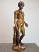 A BRONZE FIGURE OF NARCISSUS STANDING LOOKING DOWN TO WHERE HIS REFLECTION COULD BE SEEN IN WATER,