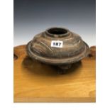 A HAN DYNASTY GREY POTTERY TRIPOD VASE, THE SHOULDERS OF THE INFLATED DISC SHAPE MOULDED WITH MASK