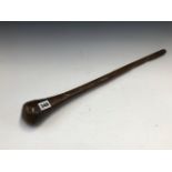 AN AFRICAN HARDWOOD CLUB SWELLING FORM THE CYLINDRICAL HANDLE TO THE HEAD. 59cms.