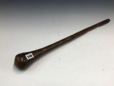 AN AFRICAN HARDWOOD CLUB SWELLING FORM THE CYLINDRICAL HANDLE TO THE HEAD. 59cms.