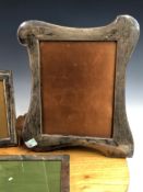 THREE 20th C. SILVER PHOTOGRAPH FRAMES, THE SMALLEST CRESTED BY A NAVAL INSIGNIA, THE LARGEST. 30