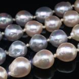 A ROPE OF BAROQUE CULTURED PEARLS IN AN OMBRE OF PINK AND GREY EACH KNOTTED INBETWEEN OF A