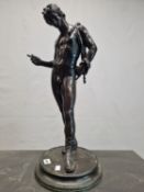 AFTER THE ANTIQUE, A BRONZE FIGURE OF NARCISSUS STANDING ON A CIRCULAR BASE LOOKING DOWN. H 62cms.